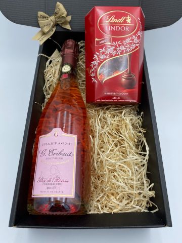 Champagne G.Tribaut Rose De Reserve Cru with a box of Belgian Lindt Milk Chocolate